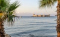 Maiden`s castle, Kiz Kalesi with palm in Mediterranean Sea. Mersin Turkey Royalty Free Stock Photo