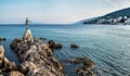 The Maiden with the Seagull. The statue is the symbol of  Opatij, Croatia. Beautiful panoramic view of Opatija town Royalty Free Stock Photo