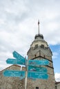 Maiden tower in istanbul with signpost showing distances to other famous