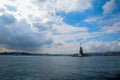 Maiden Tower or Kiz Kulesi with floating tourist boats on Bosphorus Royalty Free Stock Photo