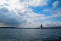 Maiden Tower or Kiz Kulesi with floating tourist boats on Bosphorus Royalty Free Stock Photo