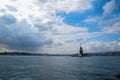 Maiden Tower or Kiz Kulesi with floating tourist boats on Bosphorus Royalty Free Stock Photo