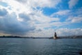 Maiden Tower or Kiz Kulesi with floating tourist boats on Bosphorus Royalty Free Stock Photo