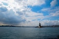 Maiden Tower or Kiz Kulesi with floating tourist boats on Bosphorus Royalty Free Stock Photo