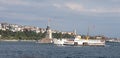 Maiden's Tower in the Bosphorus and the historical ship passing by