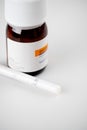 Maienfeld, GR / Switzerland - 4 January 2020: Macro shot of liquid oxycodone bottle and oral medication syringe