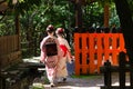 Maiko girls in Japanese garden, Kyoto Japan