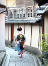 A maiko walking down the streets of Gion neighborhood in Kyoto.