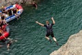 Rest and rafting on the mountain river on rafts, unforgettable impressions of the trip, jumping into the water from the bank of th