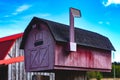 Red Barn Mailbox with Raised Flag Royalty Free Stock Photo