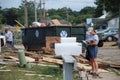 A mail woman delivers mail and life goes on despite the devastation from a tornado.