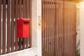 Mailbox in front of the house and gate with sunlight and beautiful natural background,The letter box looks old and damage Royalty Free Stock Photo