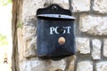 A mailbox hangs on the wall