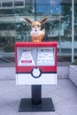 Mailbox of the Japanese Post with a statue of the character Eevee