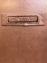 mailbox for letters on an old brown door Royalty Free Stock Photo