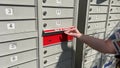 mailbox receiving letters canadian woman received package in mail red key from the box with delivery she picks up box