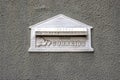 Mailbox on rough gray wall with \