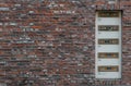 Mailbox slots on a industrial red brick wall background an old fashioned building Royalty Free Stock Photo