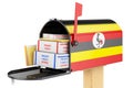 Mailbox with Ugandan flag with parcels, envelopes inside. Shipping in Ugandan, concept. 3D rendering Royalty Free Stock Photo