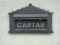 A mailbox where it reads 'cartas', a Portuguese word for 'letters'