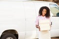 Mailman Walking Along Street Delivering Letters Royalty Free Stock Photo