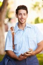 Mailman Walking Along Street Delivering Letters