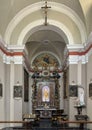 The main altar with The Madonna and Child painting in the center in the Church of St. Mary of Graces in Varenna, Italy.