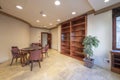 Main area of an office with a round meeting table with wooden