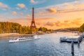 Main attraction of Paris and all of Europe is the Eiffel tower in the rays of the setting sun on the bank of Seine river with Royalty Free Stock Photo