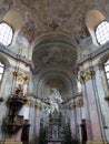 Main baroque altar and rich decorated side altars in Church Of Saint Peter and Paul