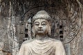 Main Buddha statue in Fengxiangsi Cave, the main one in the Longmen Grottoes in Luoyang, Henan, China. Royalty Free Stock Photo