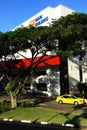 Main building of hospital and car is driving out