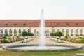 The main building of the Orangery and the fountain in the Central Park of Ansbach