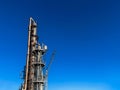 The main distillation column of oil and petroleum products in close-up with copyspace Royalty Free Stock Photo
