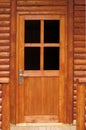 Fir wood door. The main entrance in a cottage Royalty Free Stock Photo