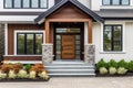 Main entrance door in house. Wooden front door with gabled porch and landing. Exterior of georgian style home cottage with columns Royalty Free Stock Photo