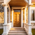 Main entrance door in house. Wooden front door with gabled porch and landing. Exterior of georgian style home cottage with white Royalty Free Stock Photo