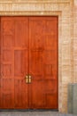 The main entrance of the European-style church, antique dark brown wooden door Royalty Free Stock Photo