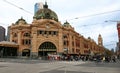 Classic and historic exterior of Flinders Street Rail Station with patina copper dome and clock tower in Melbourne cbd, Australia