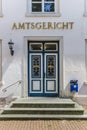 Main entrance of the historical Amtsgericht building in Aurich