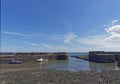 The Main entrance into Johnshaven Fishing Harbour at Low Tide on a Summers day Royalty Free Stock Photo