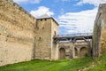 The main entrance of old castle Hotel near the river. Khotyn Fortress - medieval castle on yellow autumn hills. Ukraine, Eastern