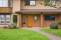 Main entrance of old family house with concrete pathway over front yard Royalty Free Stock Photo