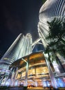 Main entrance into the Petronas Twin Towers, lit up at night by chandeliers and bright flood lights above Royalty Free Stock Photo