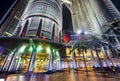 Main entrance into the Petronas Twin Towers, lit up at night by chandeliers and bright flood lights above Royalty Free Stock Photo