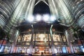 Main entrance into the Petronas Twin Towers, lit up at night by chandeliers and bright,strong flood lights above Royalty Free Stock Photo