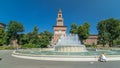 Main entrance to the Sforza Castle - Castello Sforzesco and fountain in front of it timelapse , Milan, Italy Royalty Free Stock Photo