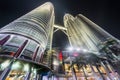 The main entrance and towering Petronas Twin Towers above,lit up at night,Kuala Lumpur,Malaysia Royalty Free Stock Photo