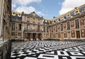 Main entrance of Versailles royal palace with ornate marble floor and decorative baroque fasade with columns Royalty Free Stock Photo