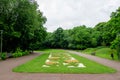 Main entry to Alexandru Buia Botanical Garden from Craiova in Dolj county, Romania, with lake, waterlillies and large green tres